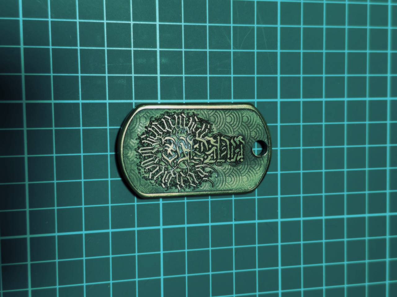 Holy Mukade brass dog tag